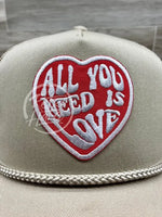 All You Need Is Love On Tan Meshback Trucker Hat Ready To Go